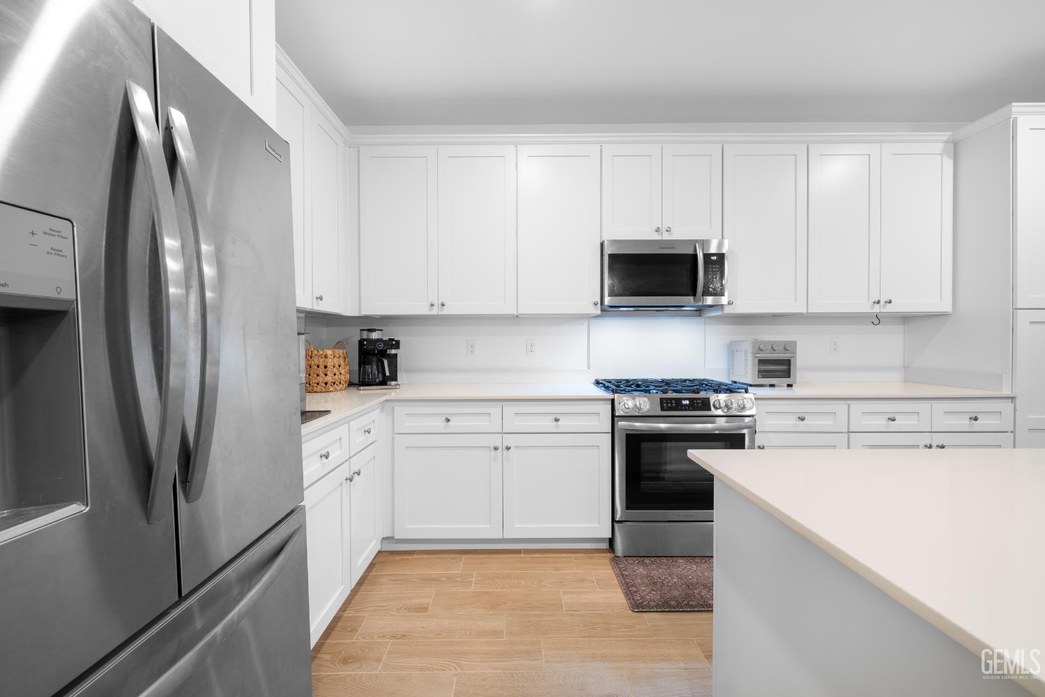 Undisclosed Address Shafter, CA 93263 - Photo 6 of 40 a kitchen with cabinets stainless steel appliances and a refrigerator