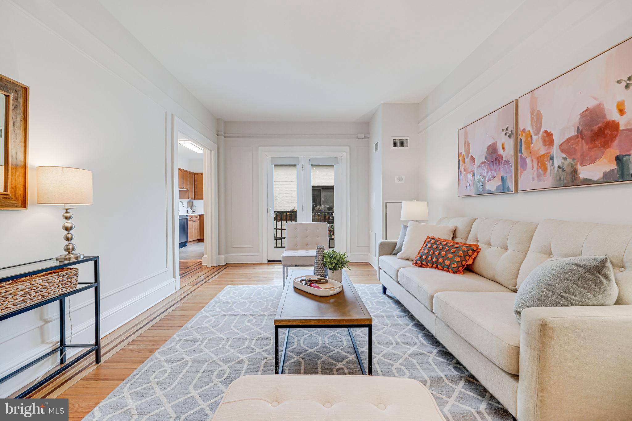 1613 Harvard Street Northwest, Unit 515 Washington, DC 20009 - Photo 14 of 53 a living room with furniture and wooden floor