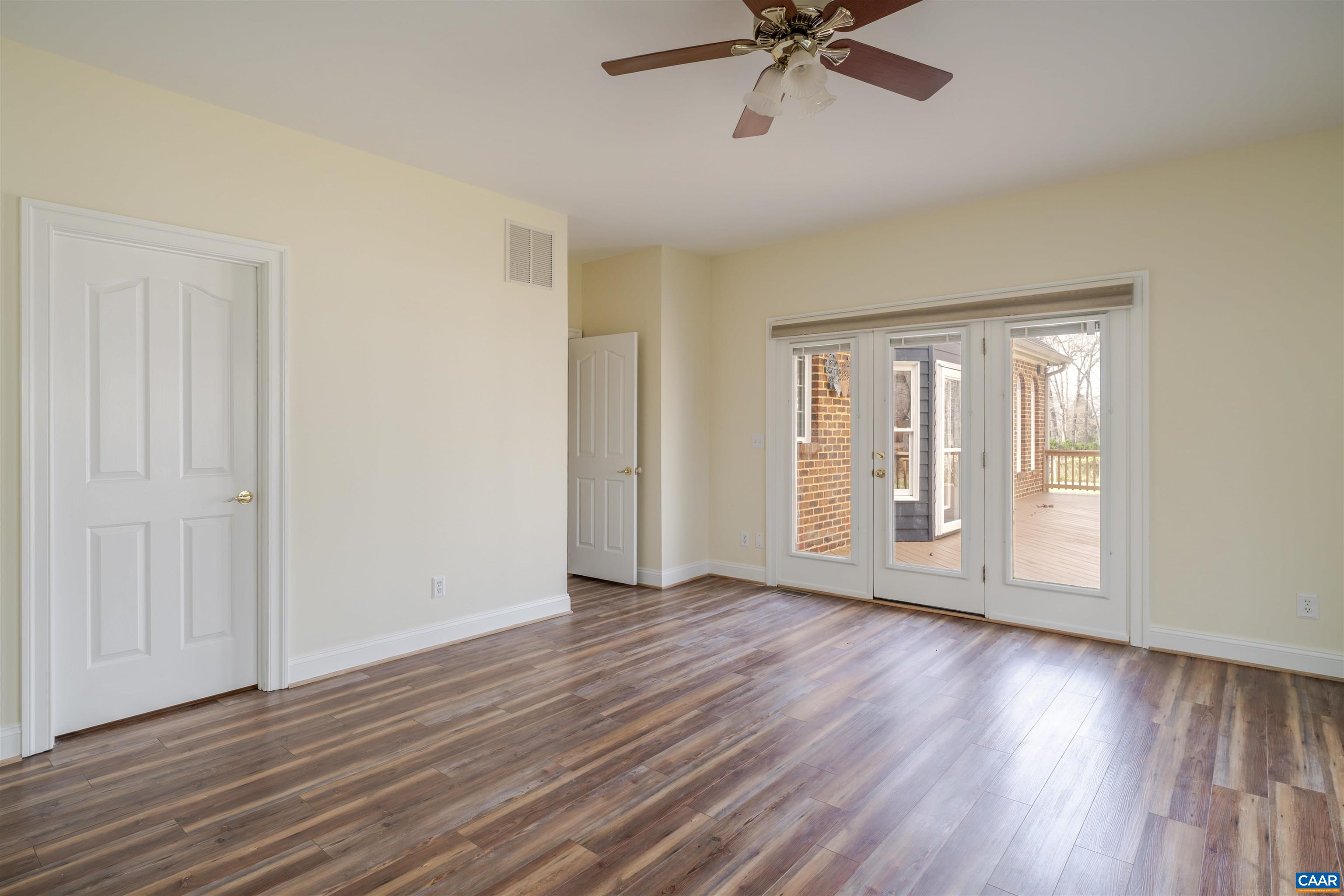 3125 Beau Mont Farm Road Charlottesville, VA 22901 - Photo 34 of 74 a view of an empty room with wooden floor and a window