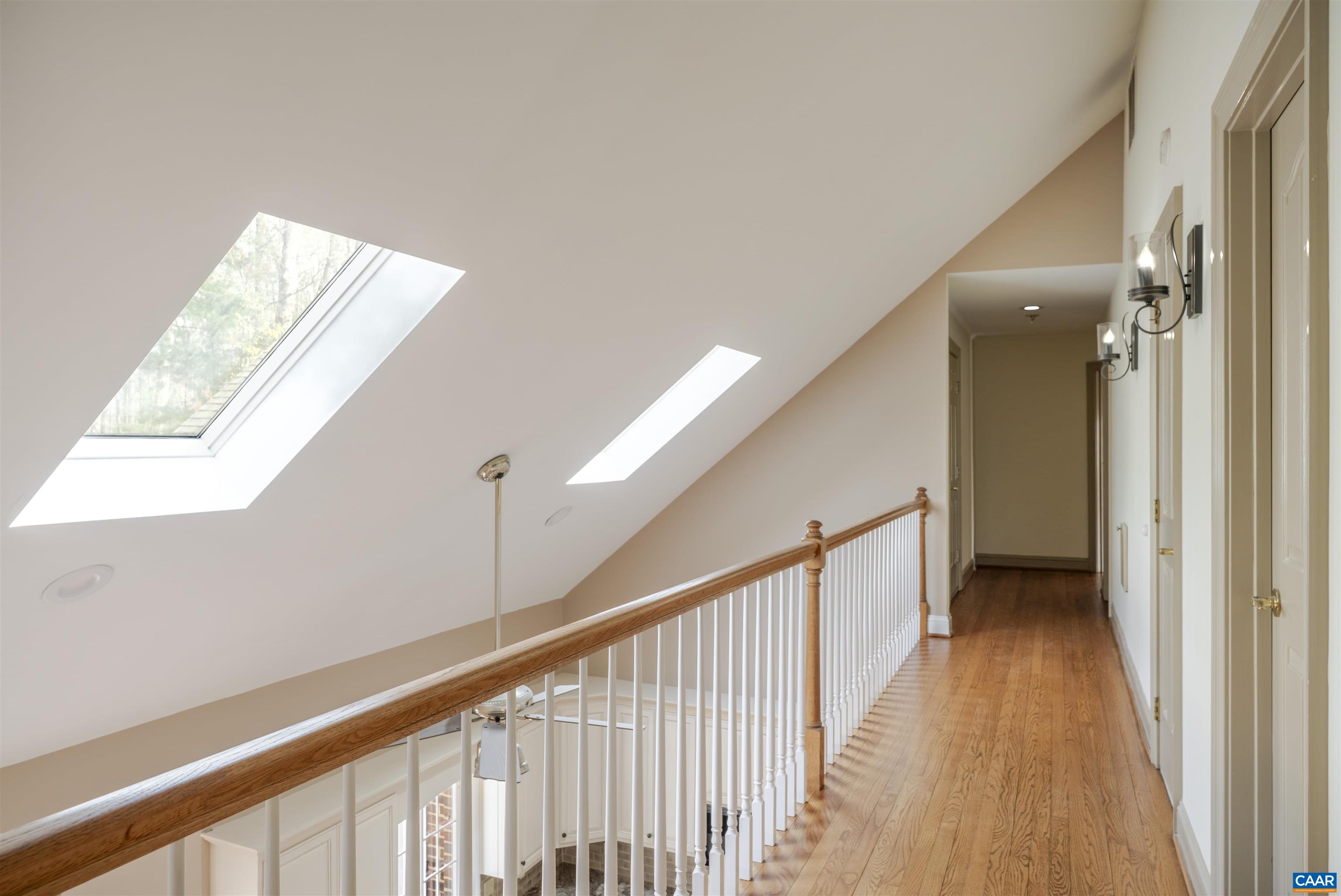 3125 Beau Mont Farm Road Charlottesville, VA 22901 - Photo 39 of 74 a view of a hallway with wooden floor and staircase