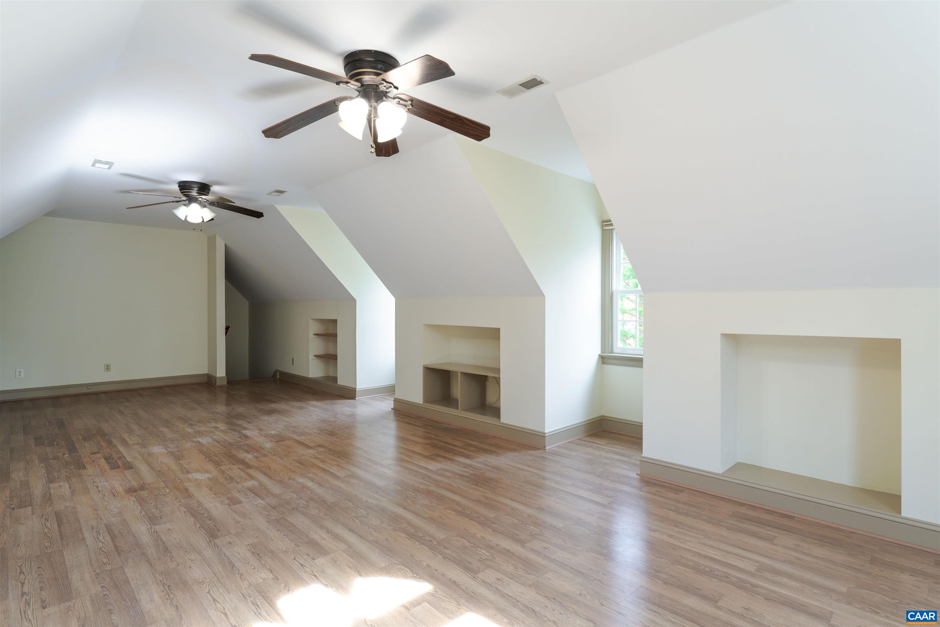 3125 Beau Mont Farm Road Charlottesville, VA 22901 - Photo 53 of 74 an empty room with wooden floor fan and windows