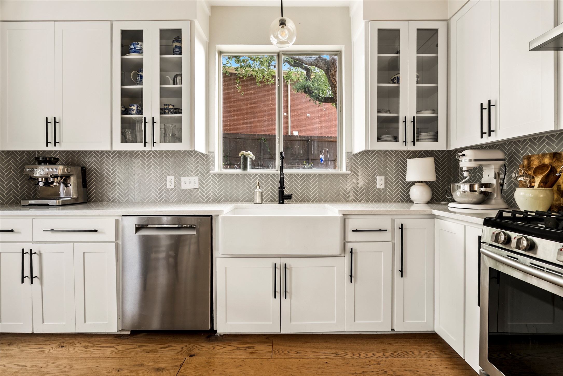 6803 Breezy Pass Austin, TX 78749 - Photo 19 of 40 a kitchen with stainless steel appliances granite countertop a sink stove and refrigerator