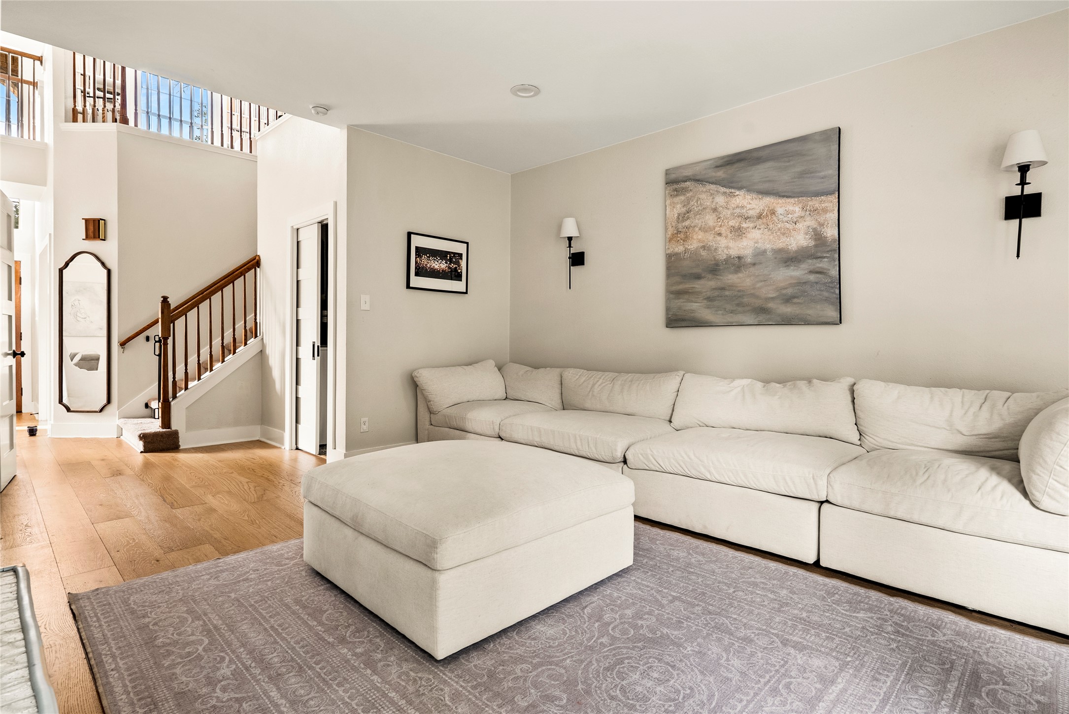 6803 Breezy Pass Austin, TX 78749 - Photo 23 of 40 a living room with white couches and white cabinets with wooden floor