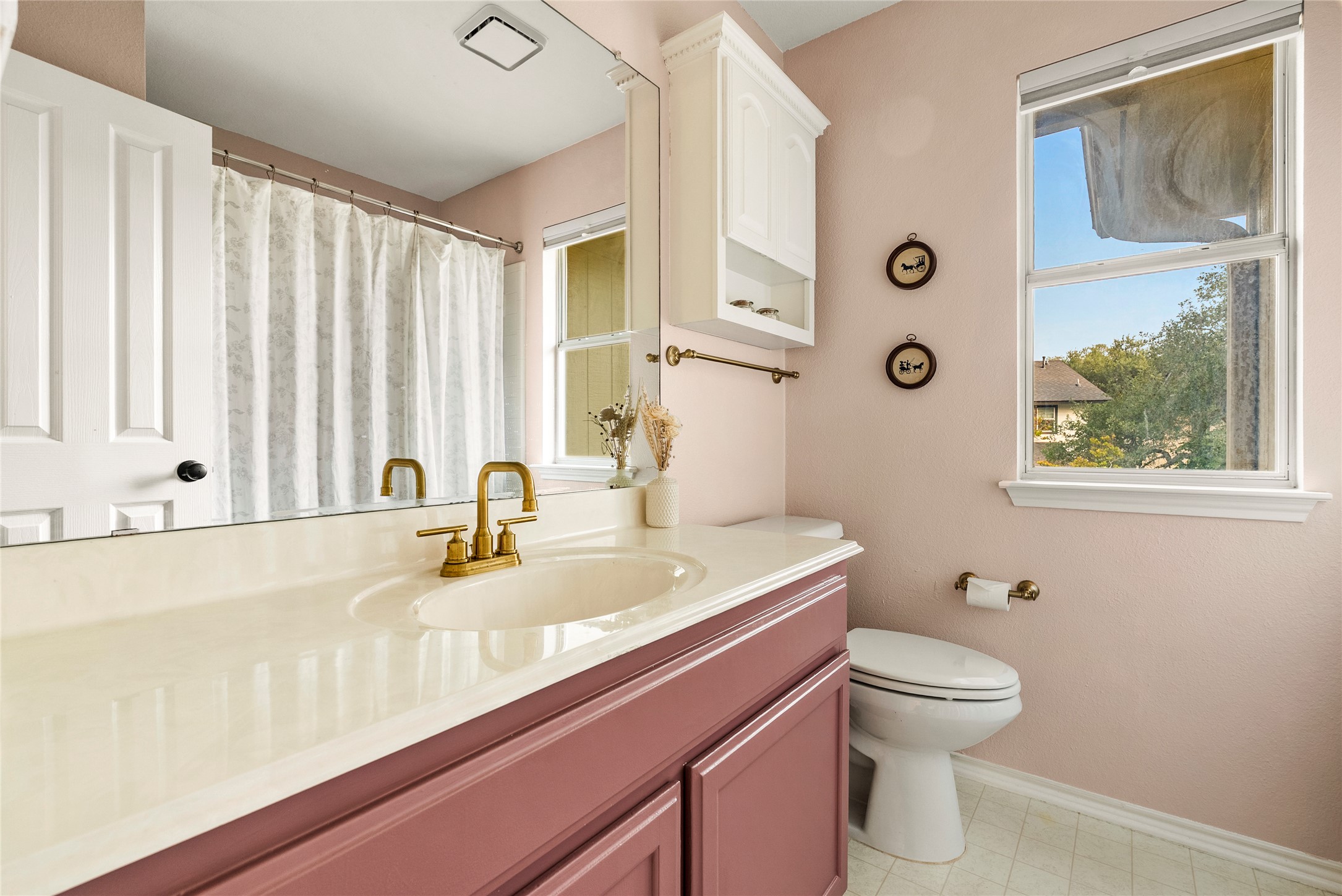 6803 Breezy Pass Austin, TX 78749 - Photo 33 of 40 a bathroom with a granite countertop sink a toilet and a mirror