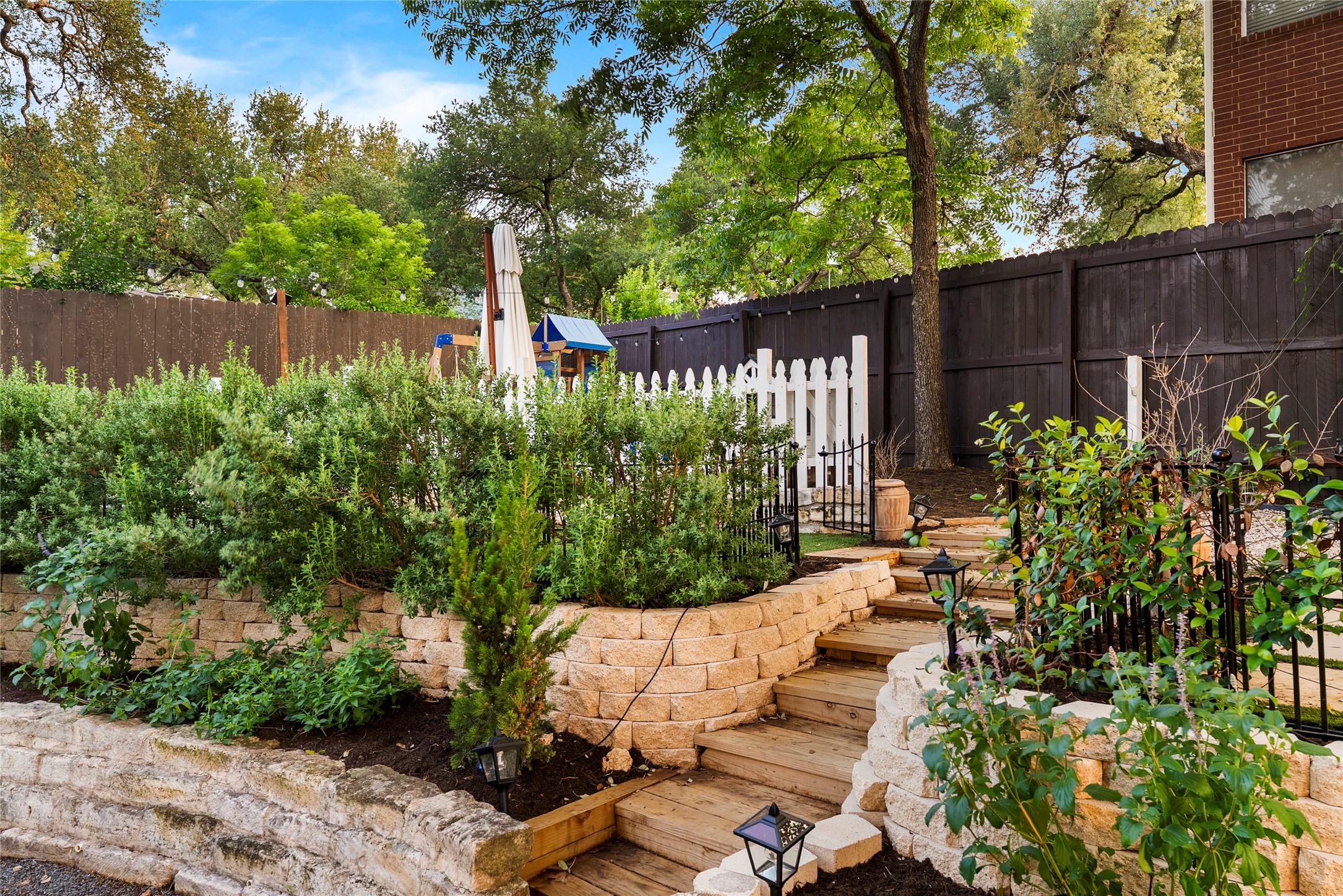 6803 Breezy Pass Austin, TX 78749 - Photo 35 of 40 a view of a backyard with plants and large trees