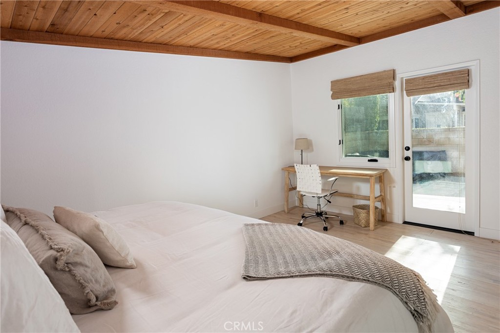 363 Ruby Street Laguna Beach, CA 92651 - Photo 14 of 25 a bedroom with a bed and a large window