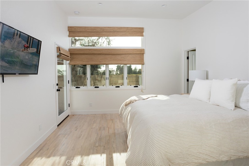 363 Ruby Street Laguna Beach, CA 92651 - Photo 16 of 25 a bed room with a bed tv and a window