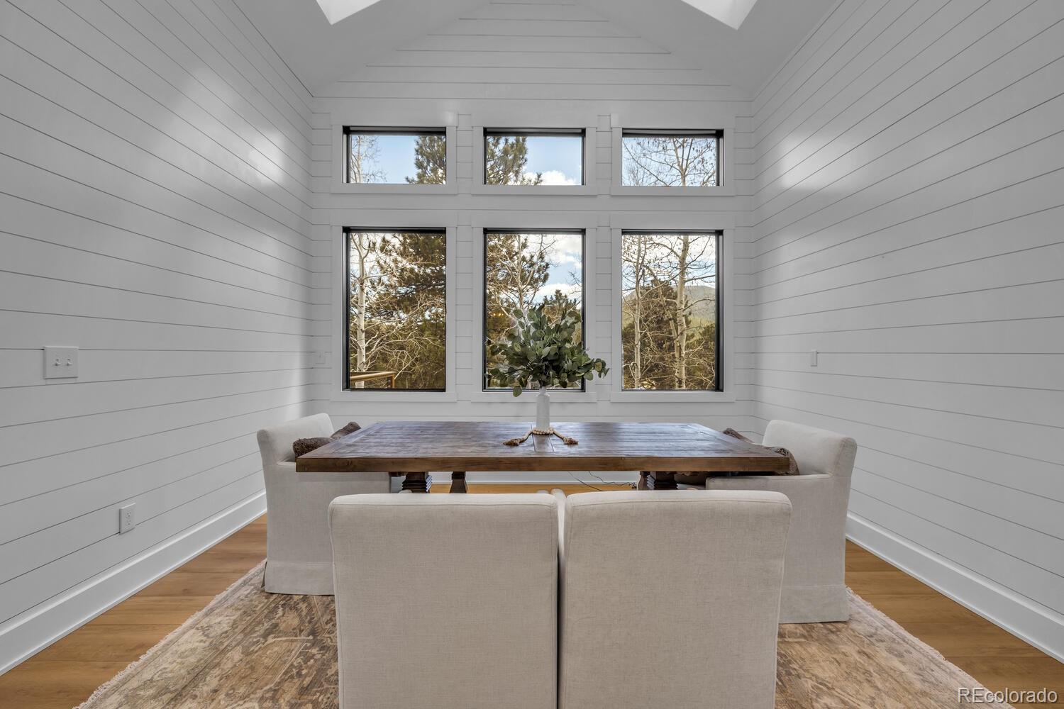 22398 Blue Jay Road Morrison, CO 80465 - Photo 15 of 39 a dining table with a window