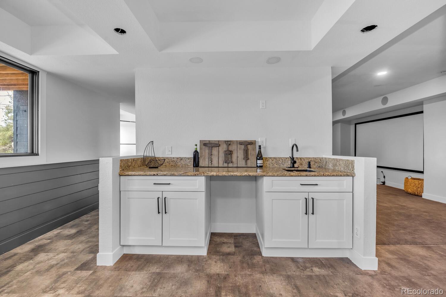 22398 Blue Jay Road Morrison, CO 80465 - Photo 24 of 39 a kitchen with a sink and cabinets