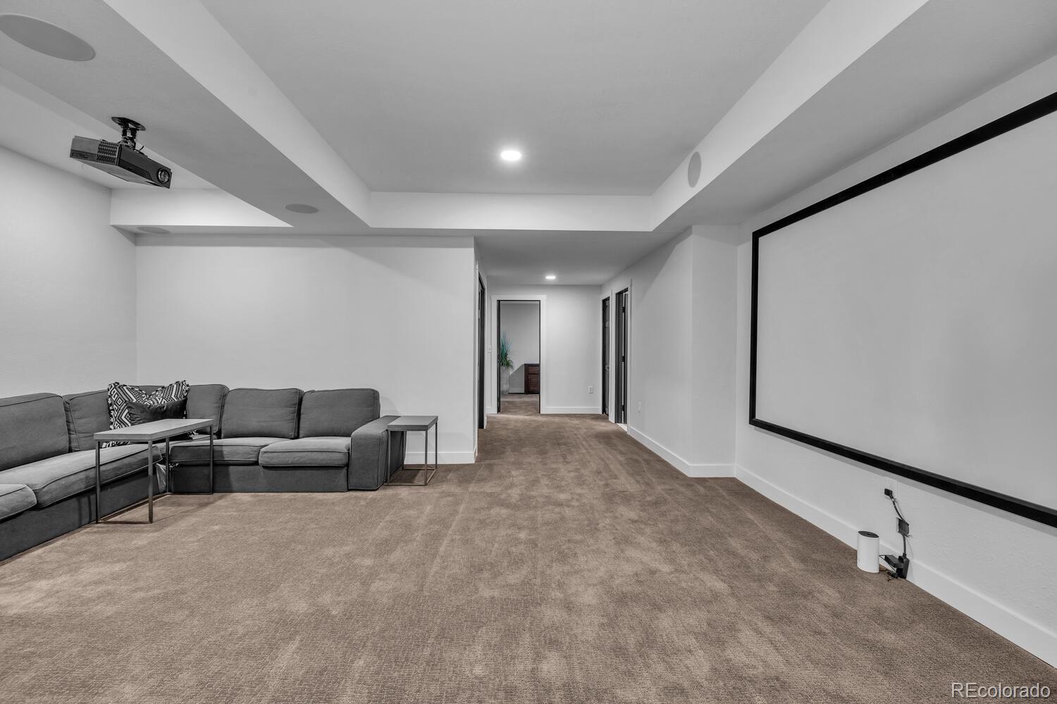 22398 Blue Jay Road Morrison, CO 80465 - Photo 25 of 39 a living room with furniture and a flat screen tv