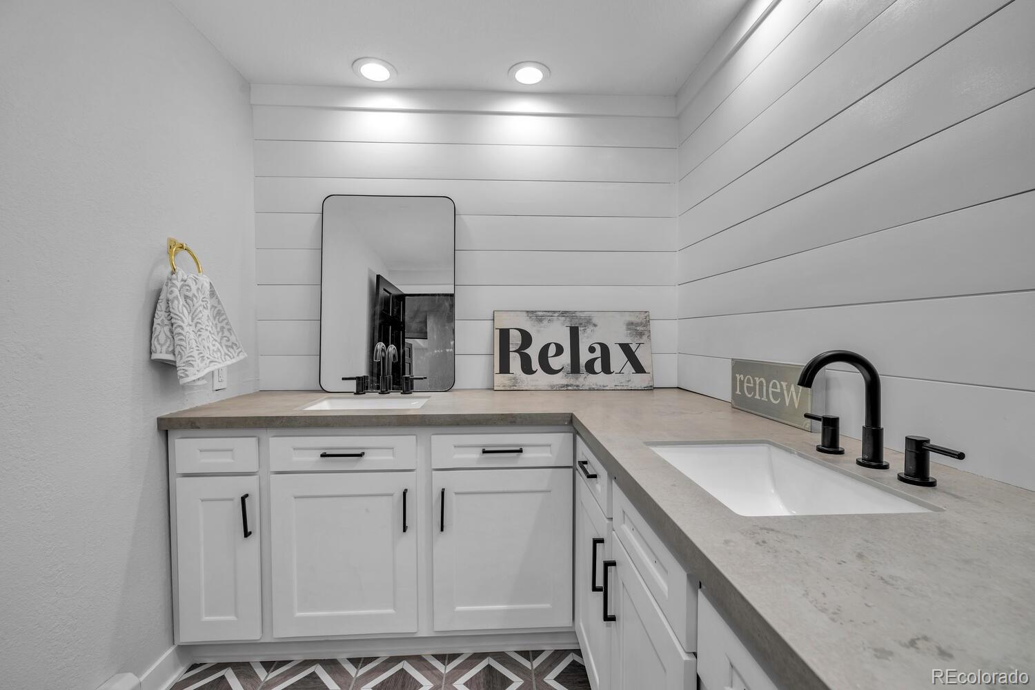 22398 Blue Jay Road Morrison, CO 80465 - Photo 28 of 39 a bathroom with a sink and a mirror