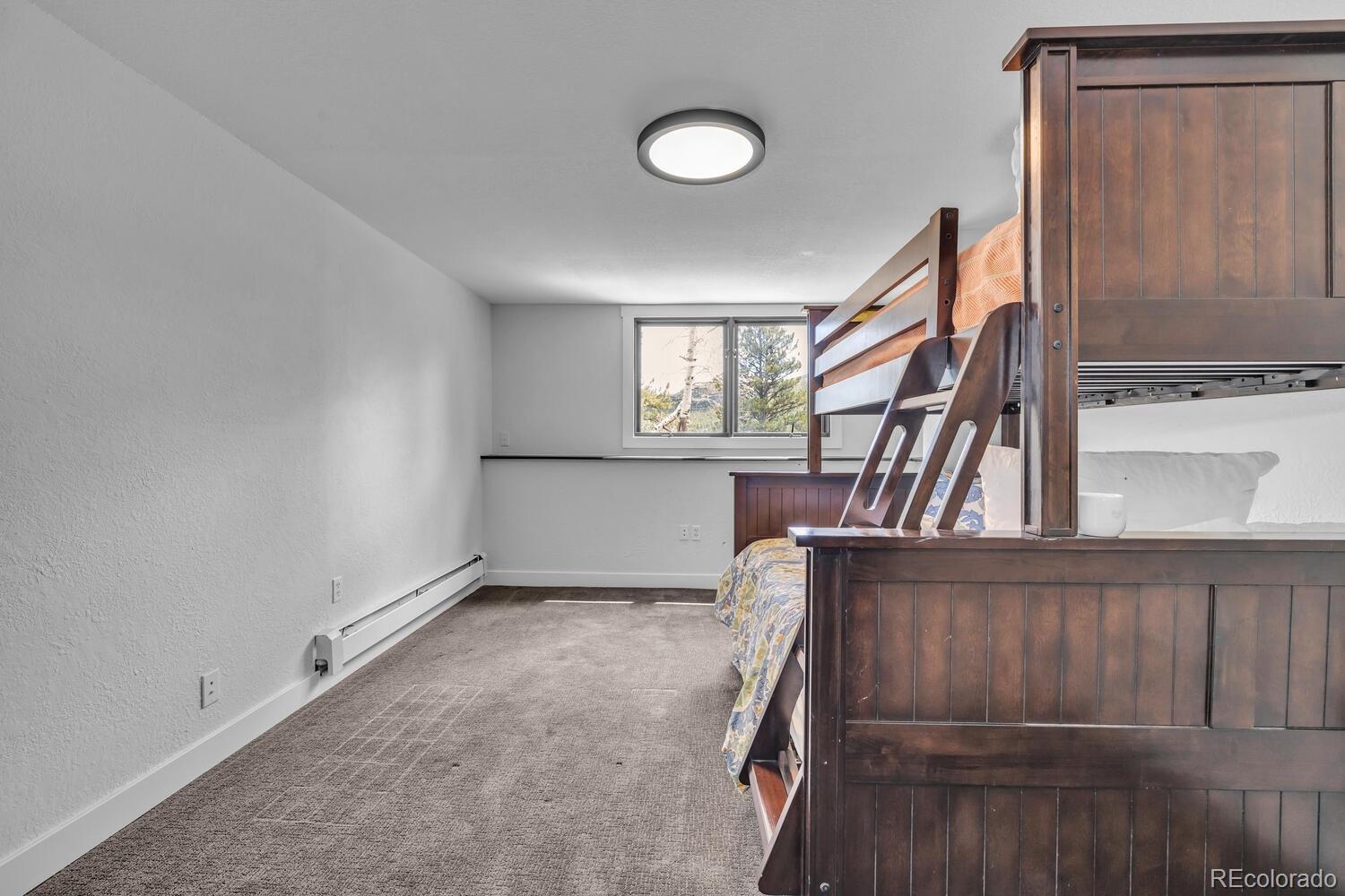 22398 Blue Jay Road Morrison, CO 80465 - Photo 30 of 39 a view of entryway with wooden floor