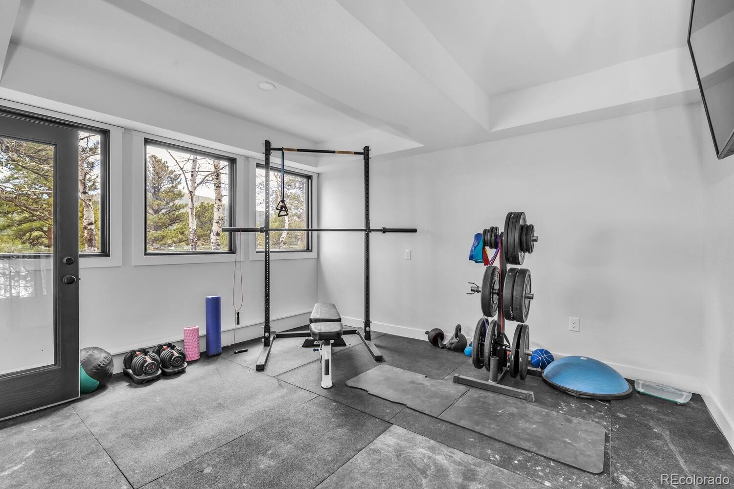 22398 Blue Jay Road Morrison, CO 80465 - Photo 31 of 39 a view of a room with gym equipment