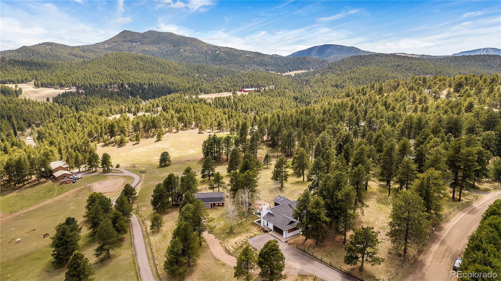 22398 Blue Jay Road Morrison, CO 80465 - Photo 38 of 39 a view of a town with mountains in the background