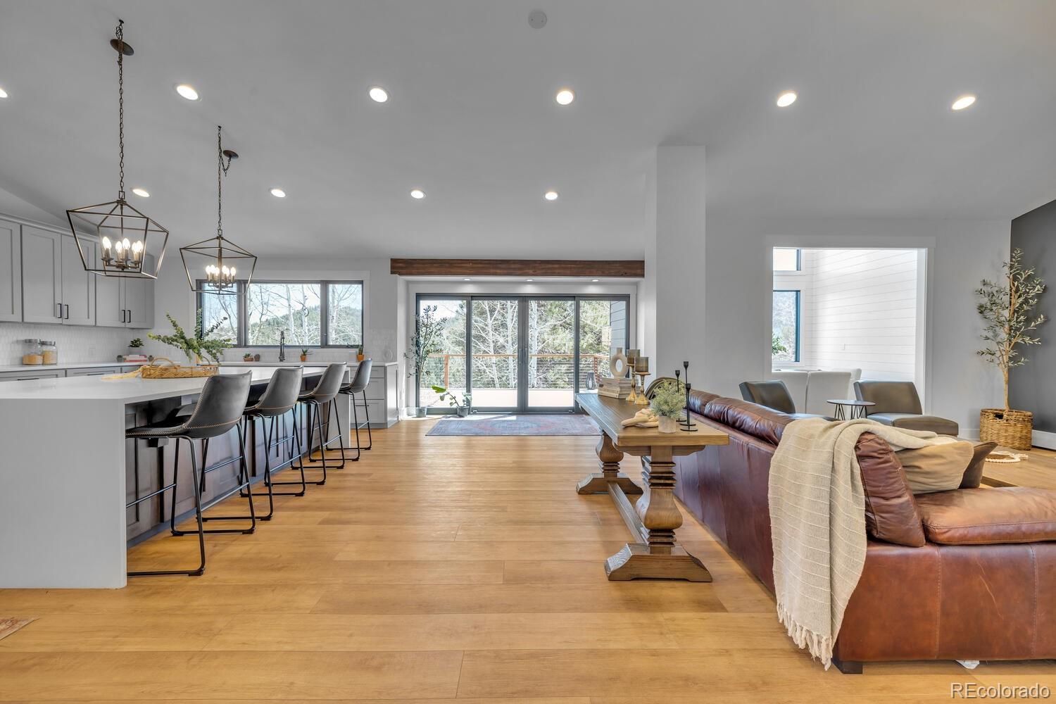 22398 Blue Jay Road Morrison, CO 80465 - Photo 6 of 39 a very nice looking living room with furniture and a large window
