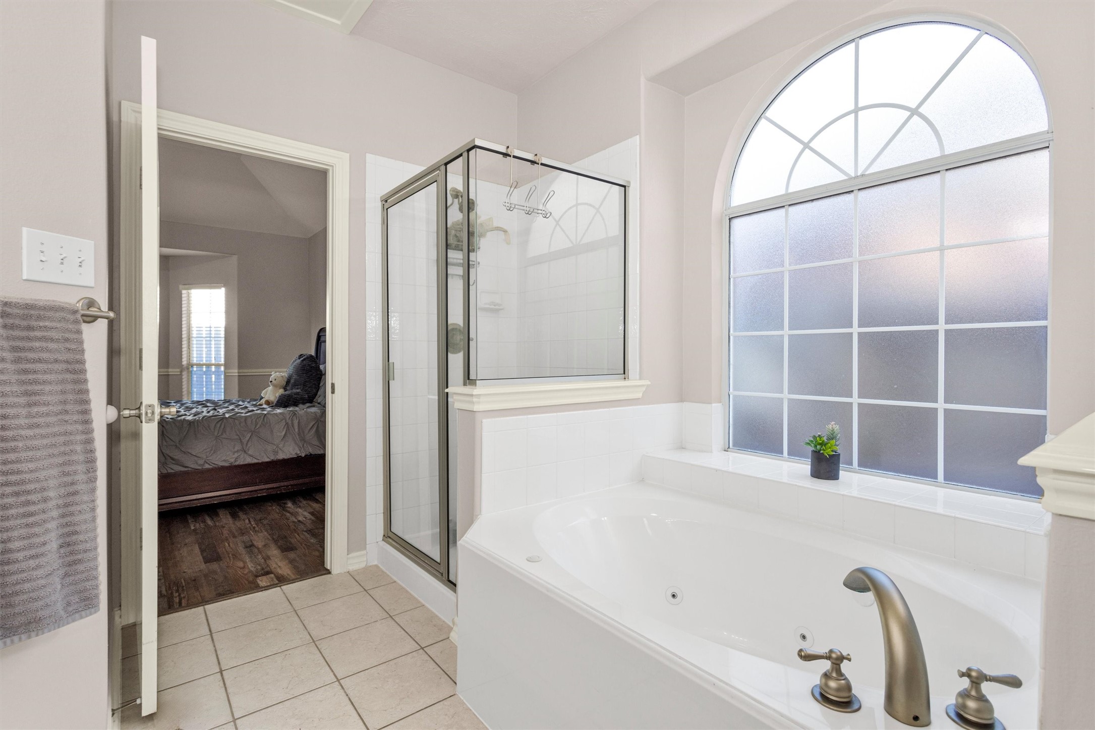 30110 Legends Ridge Drive Spring, TX 77386 - Photo 27 of 49 a bathroom with a tub a mirror and a shower