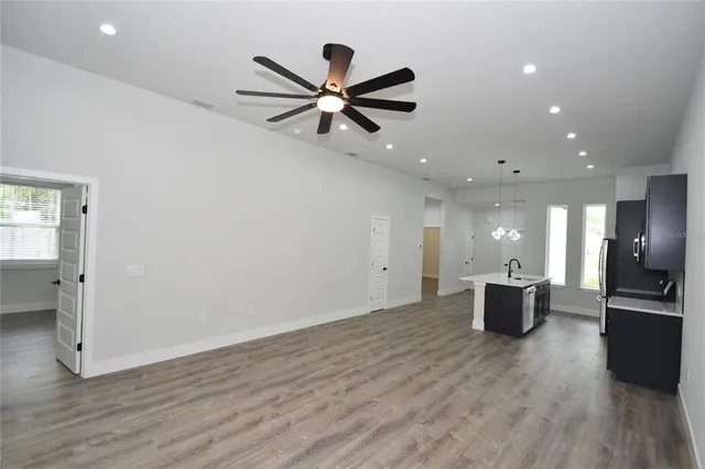 a view of a kitchen with workspace and a window