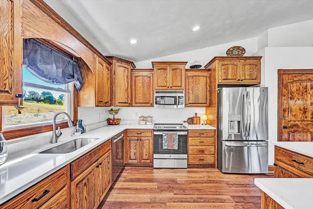 a bathroom with a double vanity sink toilet and shower