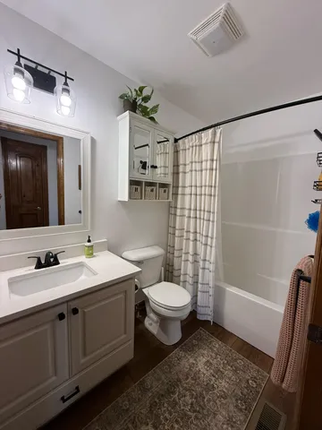 a view of a hallway with washer and dryer