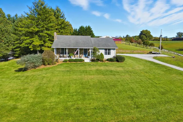 a living room with fireplace furniture and a flat screen tv