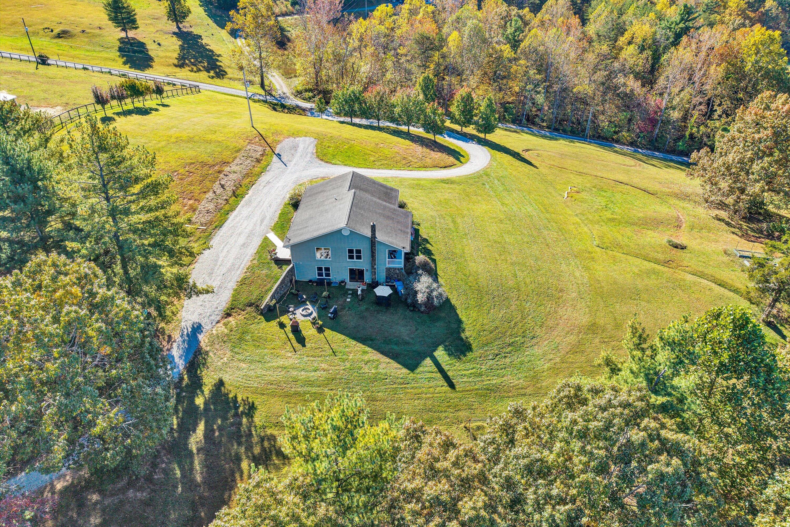 99 Spruce Lane Callaway, VA 24067 - Photo 61 of 66 a view of a swimming pool with a yard