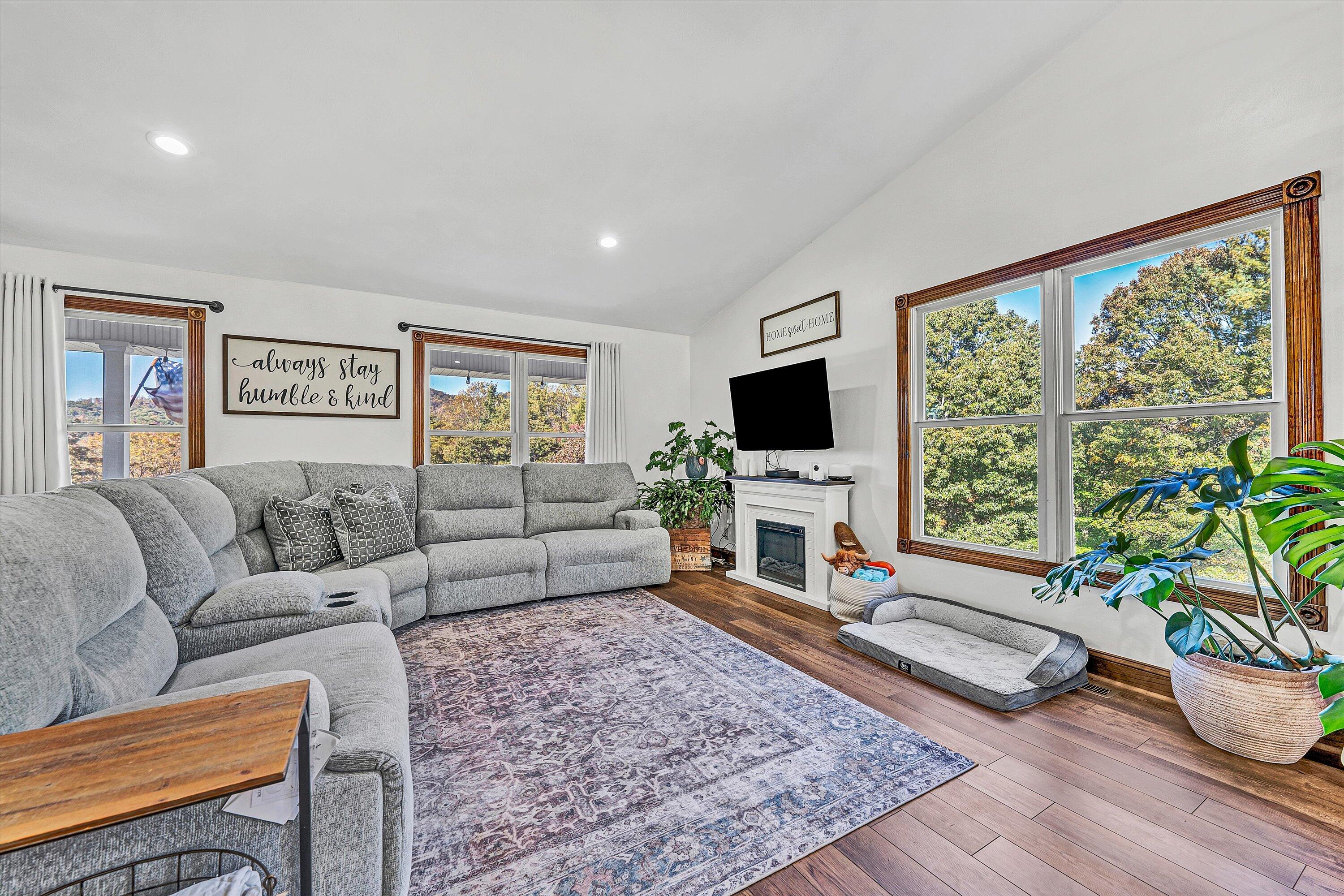 99 Spruce Lane Callaway, VA 24067 - Photo 10 of 66 a living room with furniture and a flat screen tv