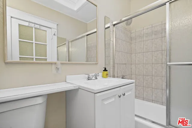 a dining room with furniture a chandelier and window