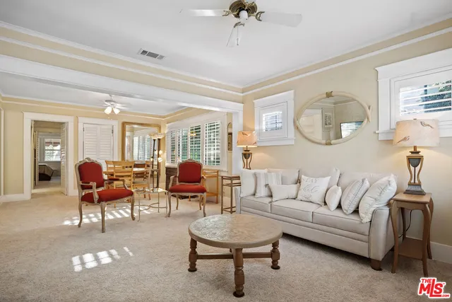 a building outdoor space with patio furniture and potted plants