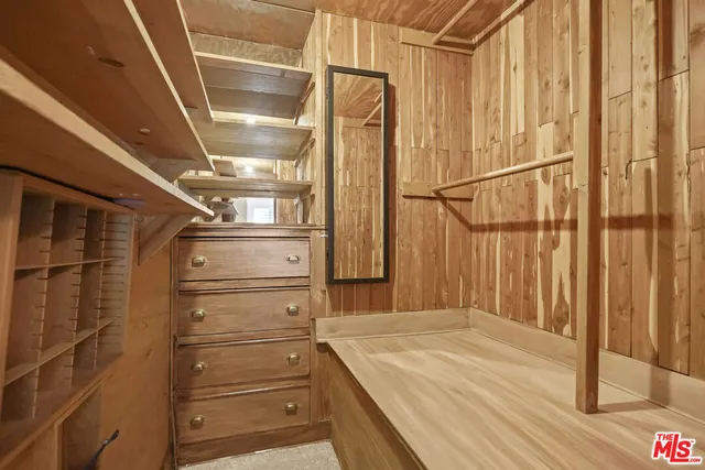 a living room with fireplace furniture and a large window