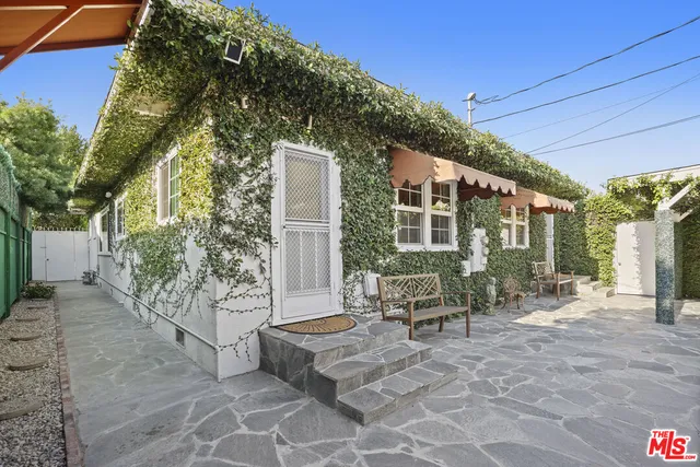 a bedroom with a bed window and walk in closet