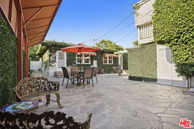 an aerial view of a house with yard swimming pool and outdoor seating