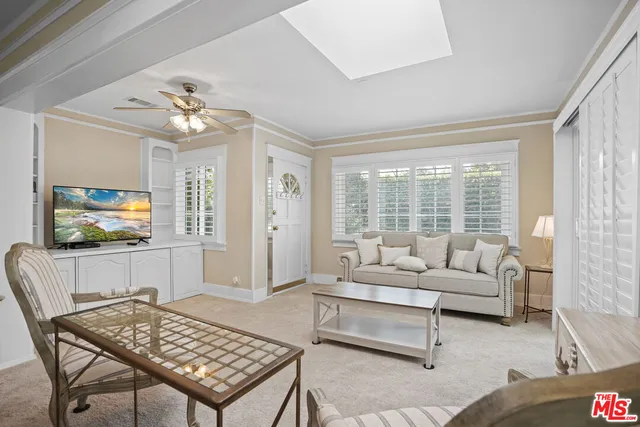 a utility room with a sink dryer and cabinets