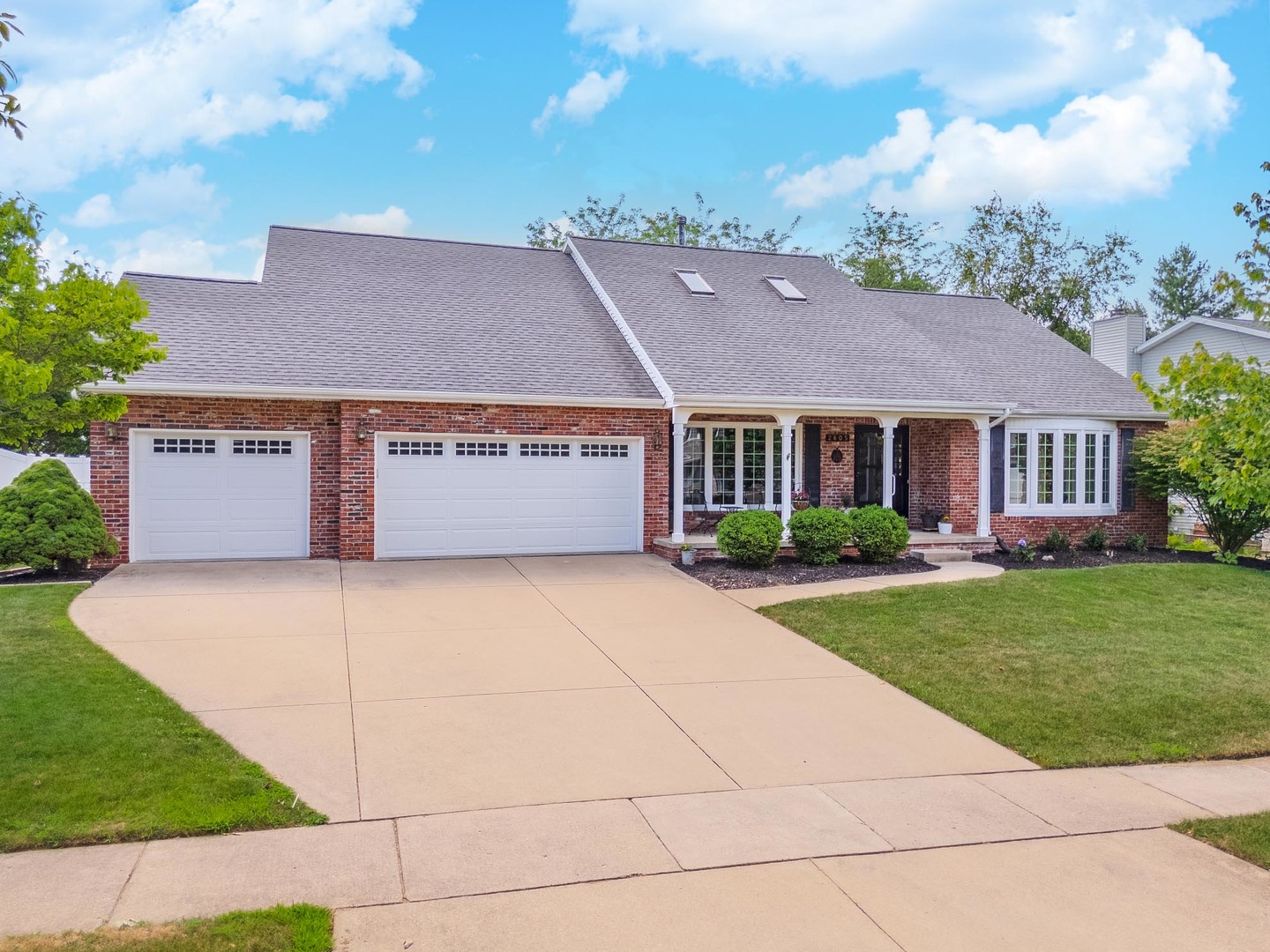 front view of a house with a yard