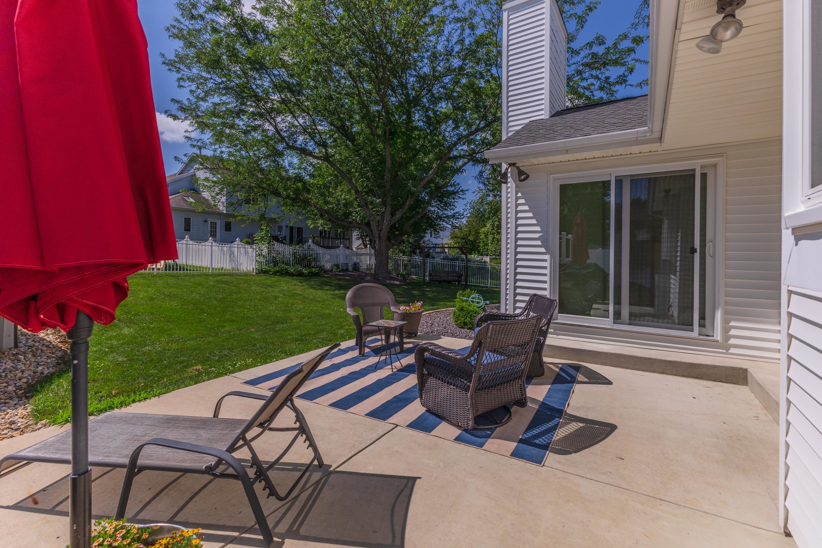 2605 Park Ridge Road Bloomington, IL 61704 - Photo 21 of 69 a view of a patio with table and chairs and potted plants