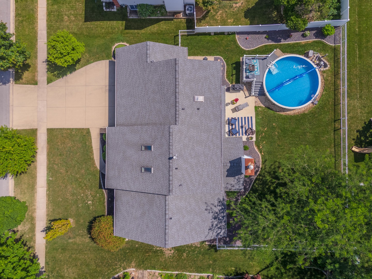 2605 Park Ridge Road Bloomington, IL 61704 - Photo 22 of 69 an aerial view of a house with a garden and a swimming pool