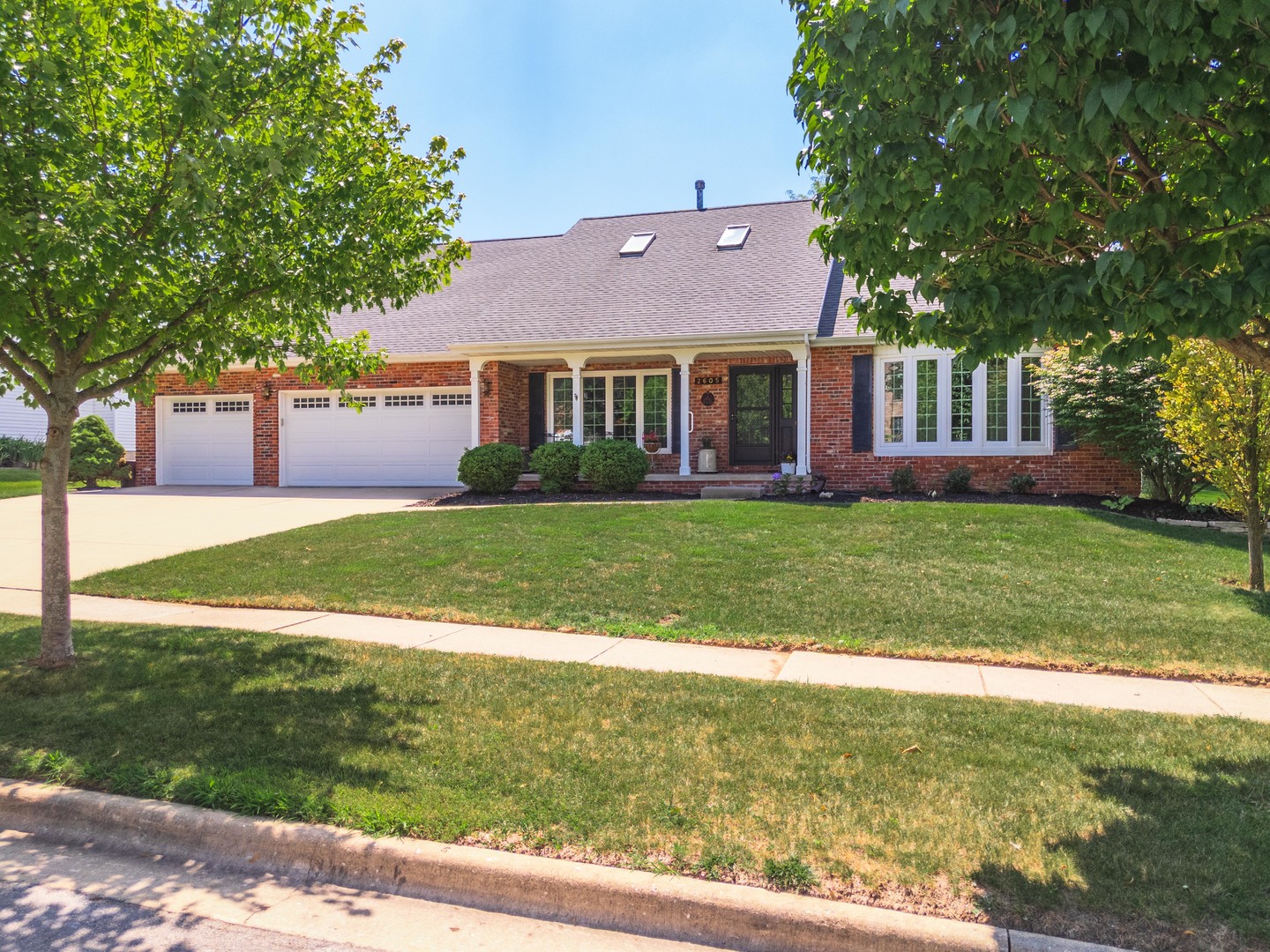 2605 Park Ridge Road Bloomington, IL 61704 - Photo 33 of 69 a view of a house with a big yard and large trees