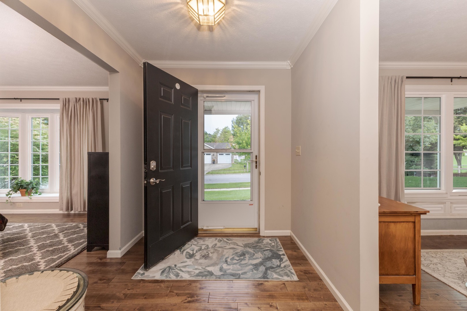 2605 Park Ridge Road Bloomington, IL 61704 - Photo 34 of 69 a view of entryway with wooden floor and a chandelier