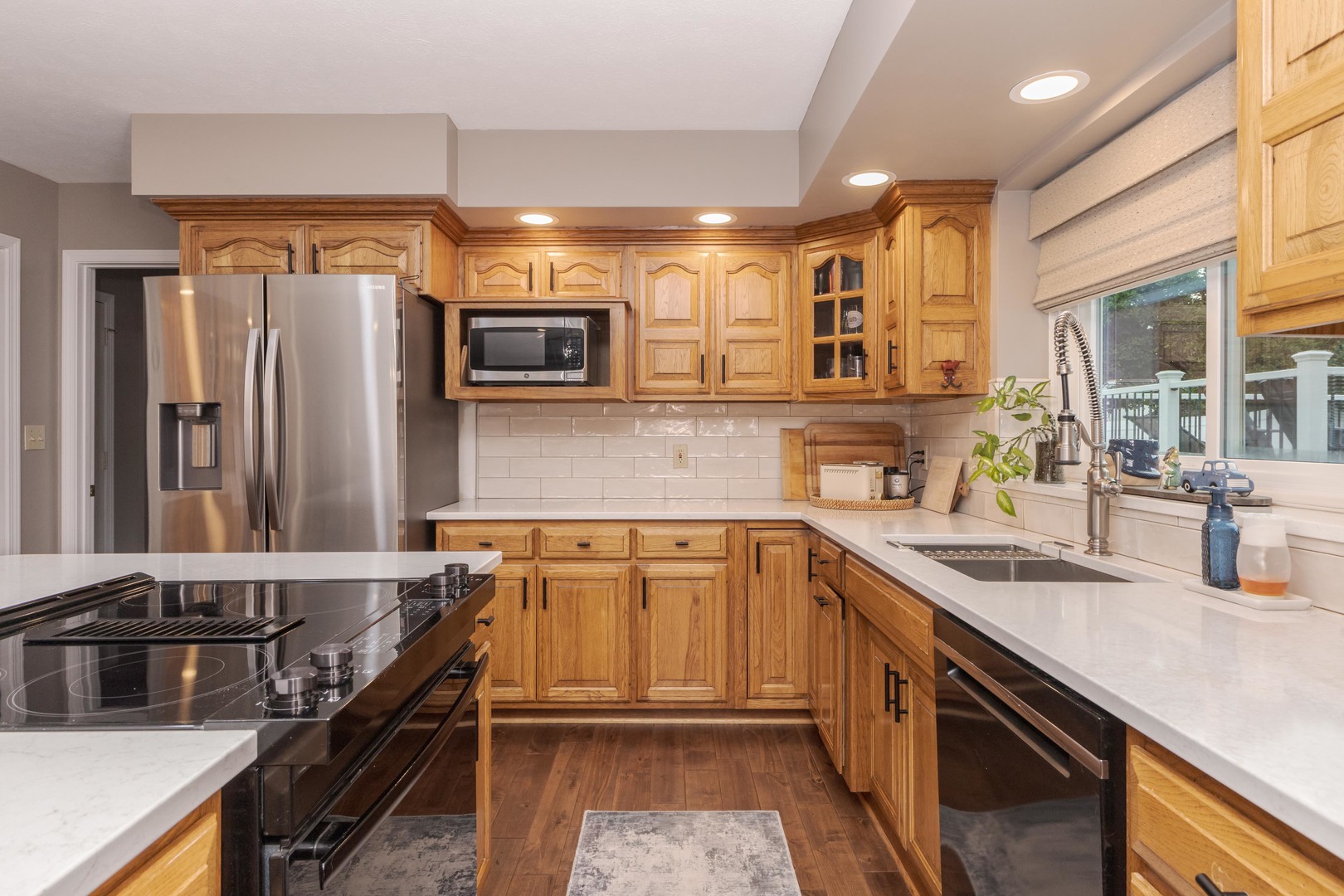 2605 Park Ridge Road Bloomington, IL 61704 - Photo 40 of 69 a kitchen with stainless steel appliances a sink stove and refrigerator