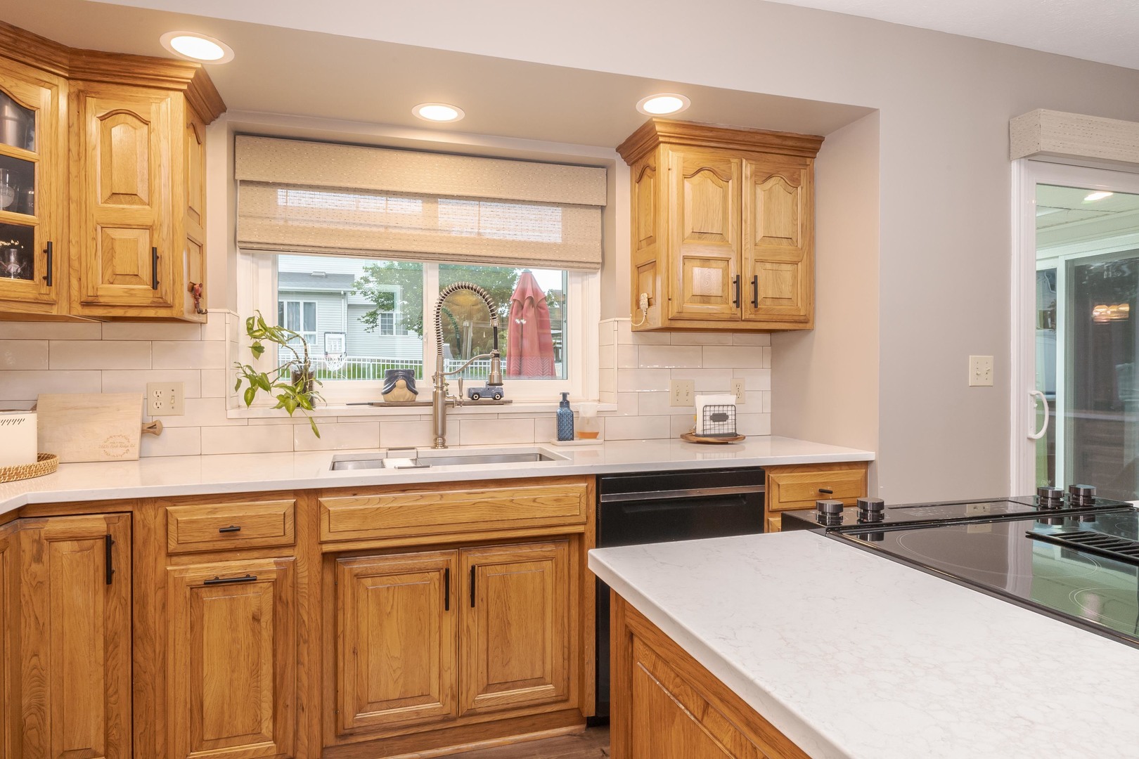 2605 Park Ridge Road Bloomington, IL 61704 - Photo 42 of 69 a kitchen with a sink stove and cabinets