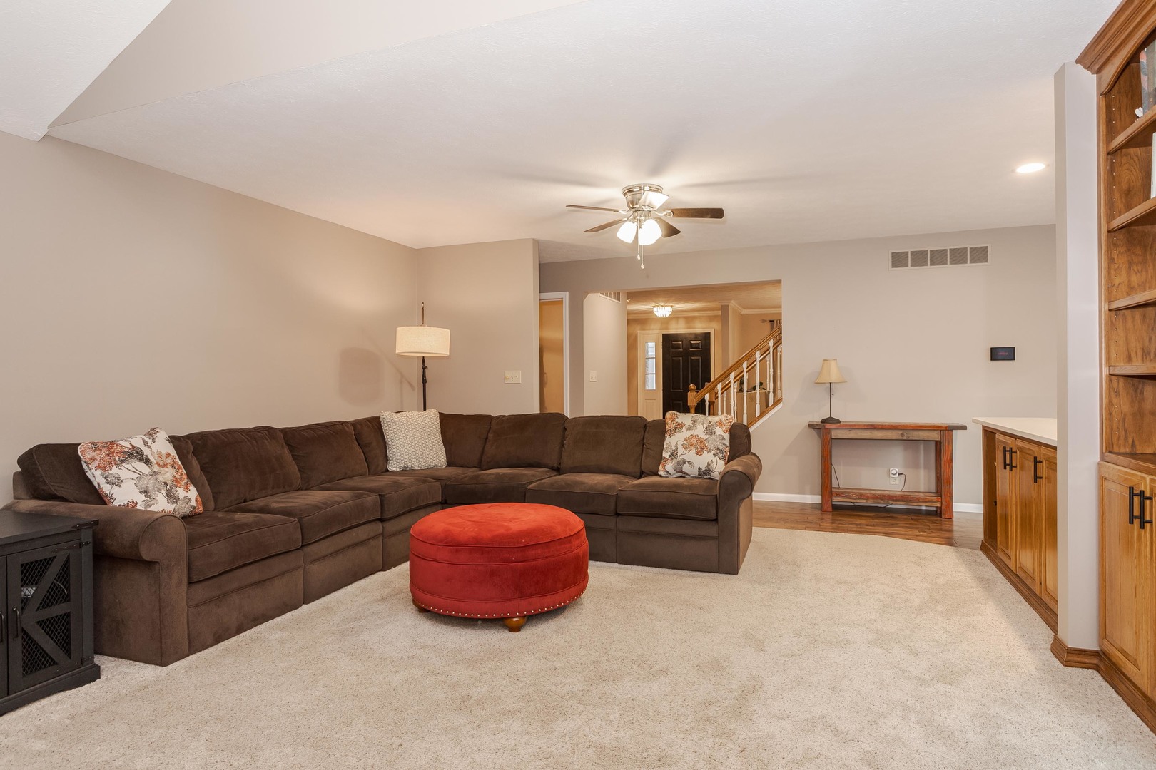 2605 Park Ridge Road Bloomington, IL 61704 - Photo 48 of 69 a living room with furniture and a chandelier