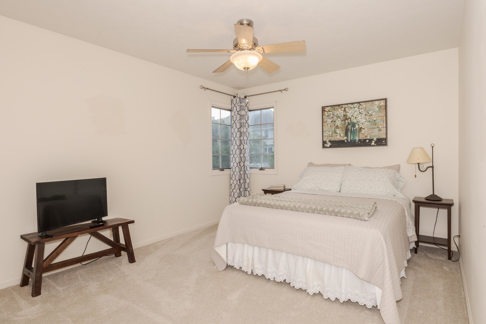 2605 Park Ridge Road Bloomington, IL 61704 - Photo 58 of 69 a bedroom with a bed and a chandelier