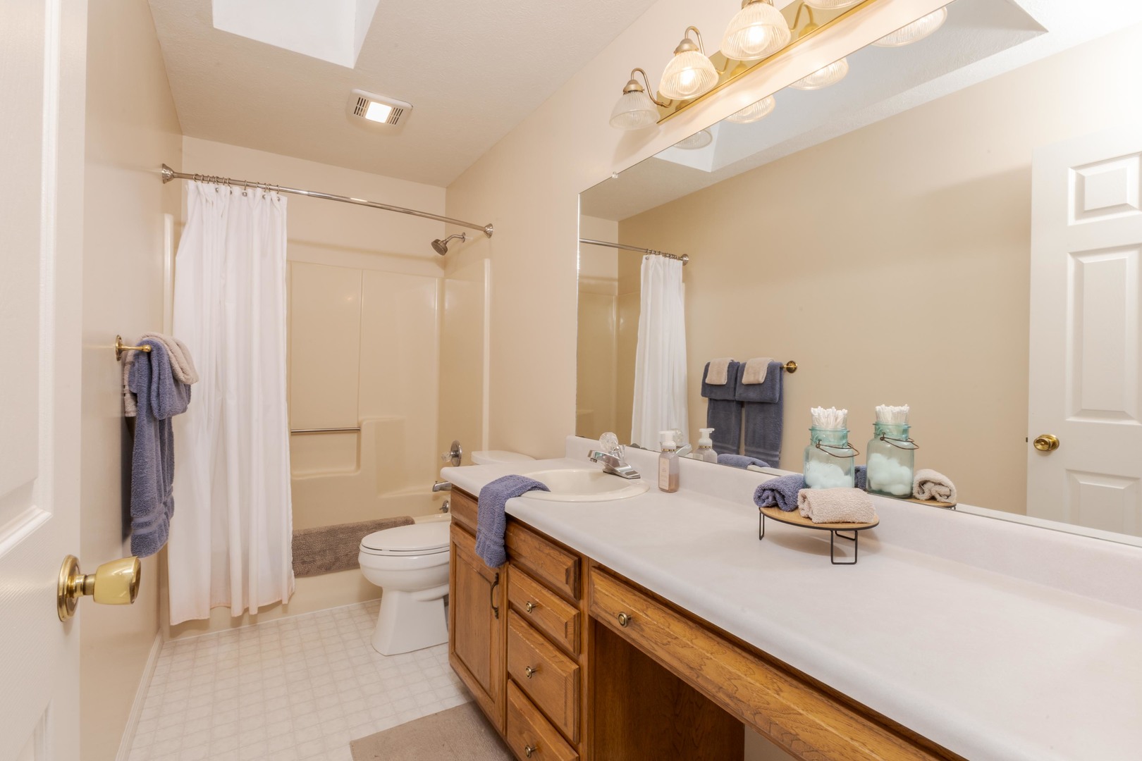 2605 Park Ridge Road Bloomington, IL 61704 - Photo 59 of 69 a bathroom with a double vanity sink mirror and toilet