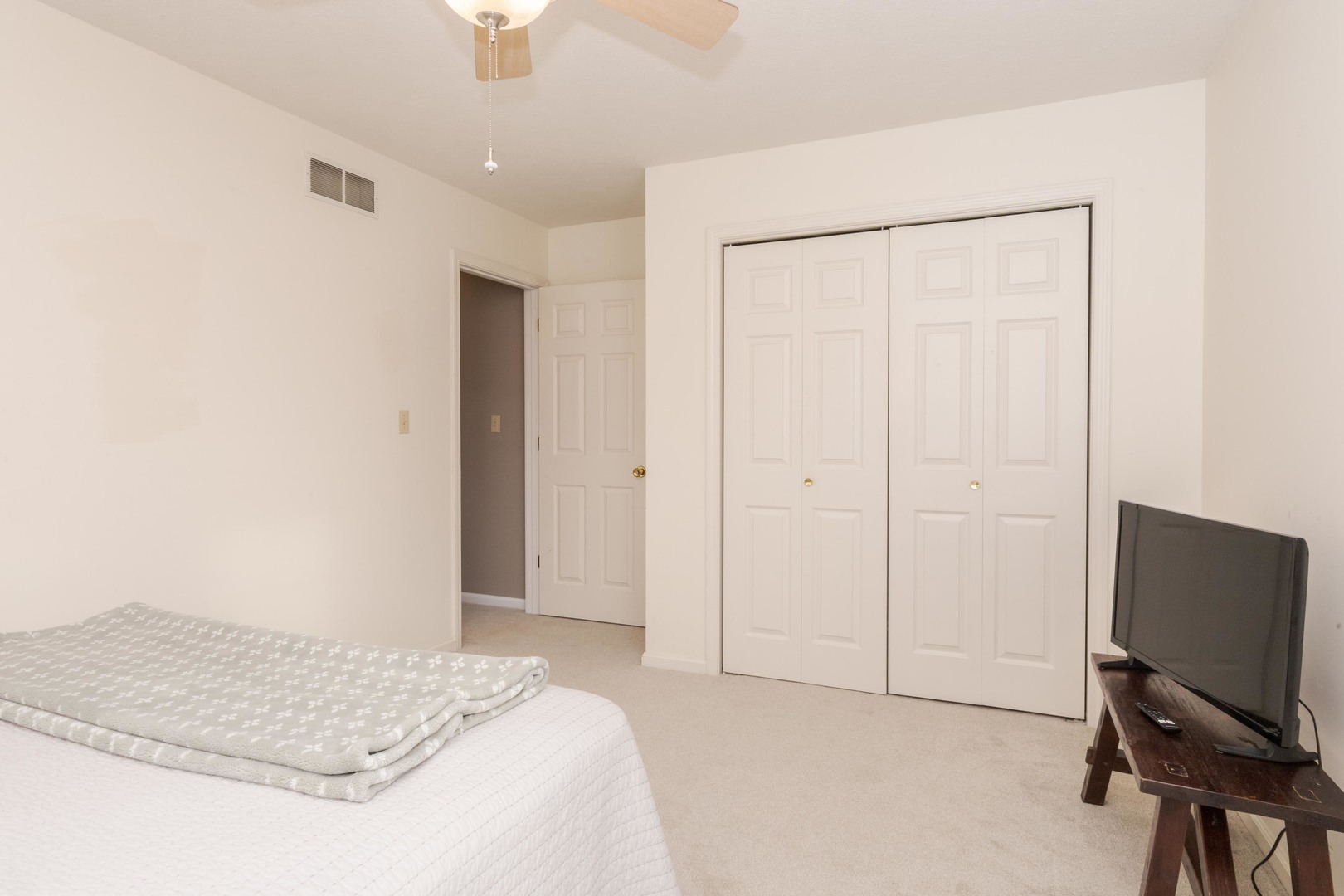 2605 Park Ridge Road Bloomington, IL 61704 - Photo 60 of 69 a bedroom with a bed and a flat screen tv