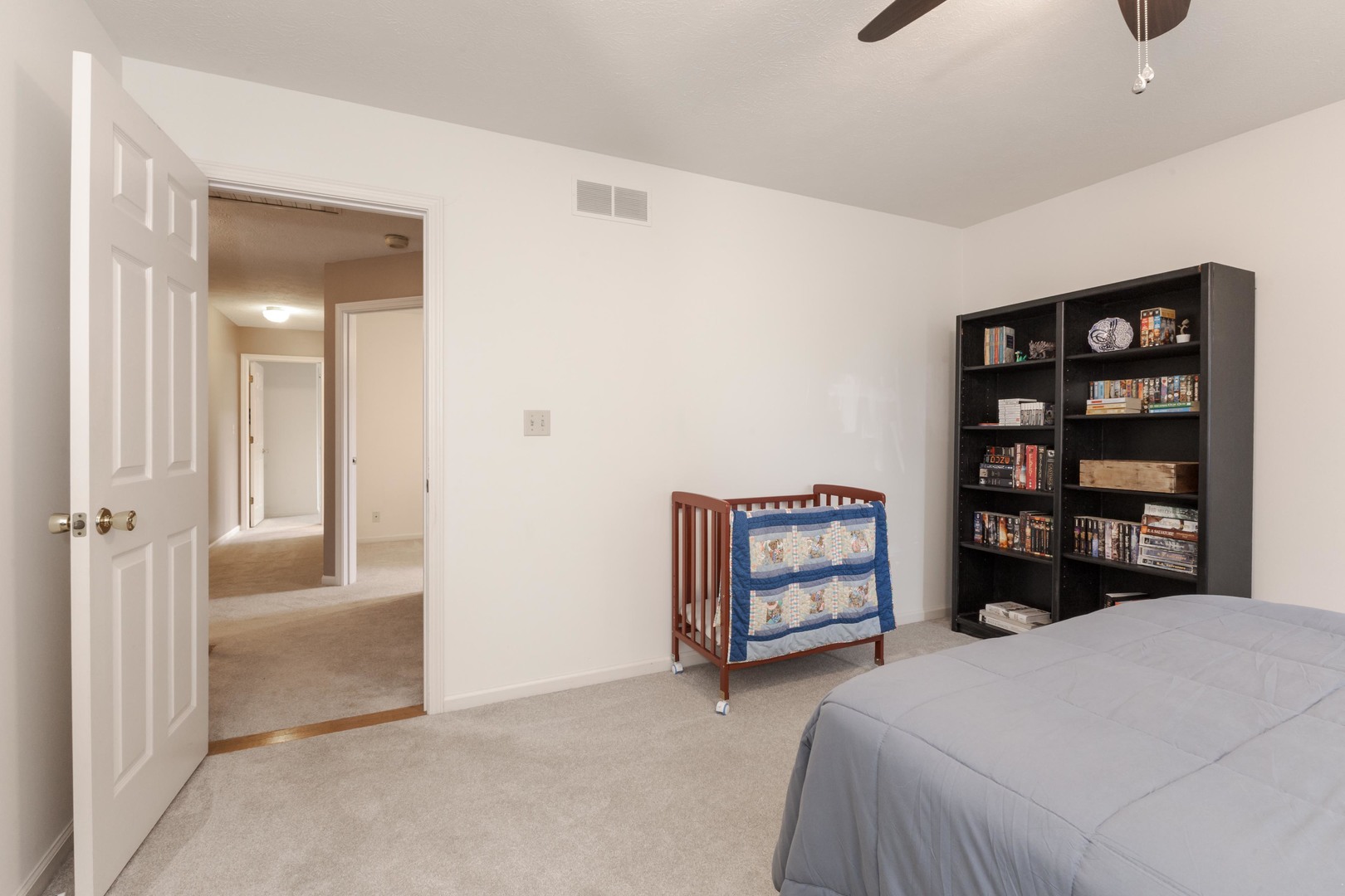 2605 Park Ridge Road Bloomington, IL 61704 - Photo 62 of 69 a bedroom with a bed and a walk in closet