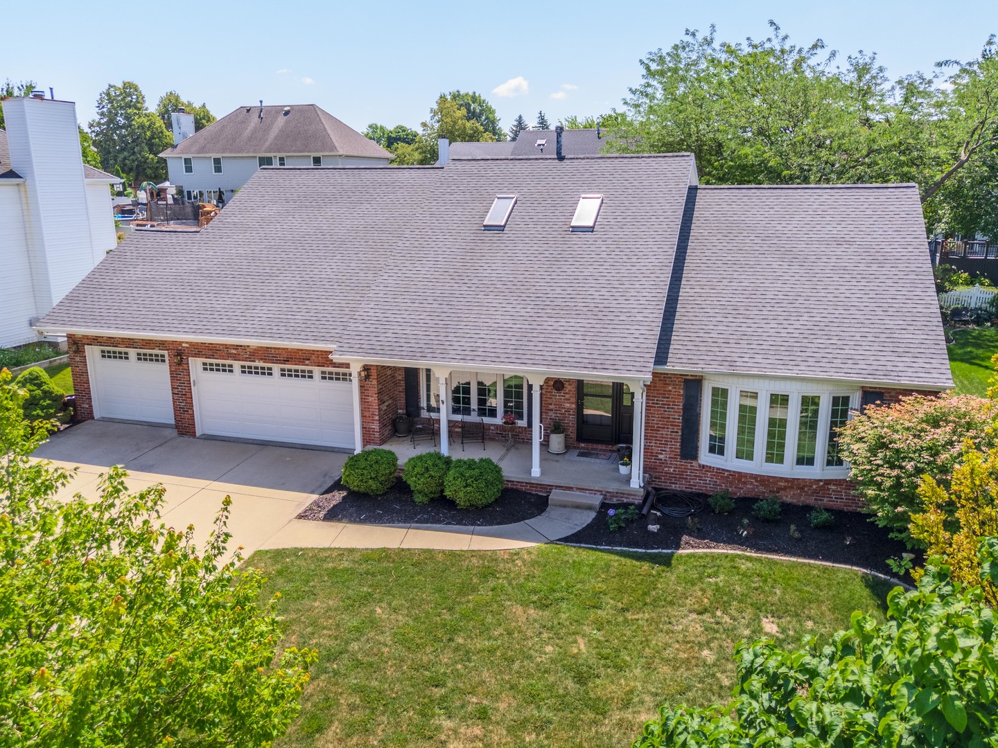 2605 Park Ridge Road Bloomington, IL 61704 - Photo 8 of 69 an aerial view of a house with swimming pool and a yard