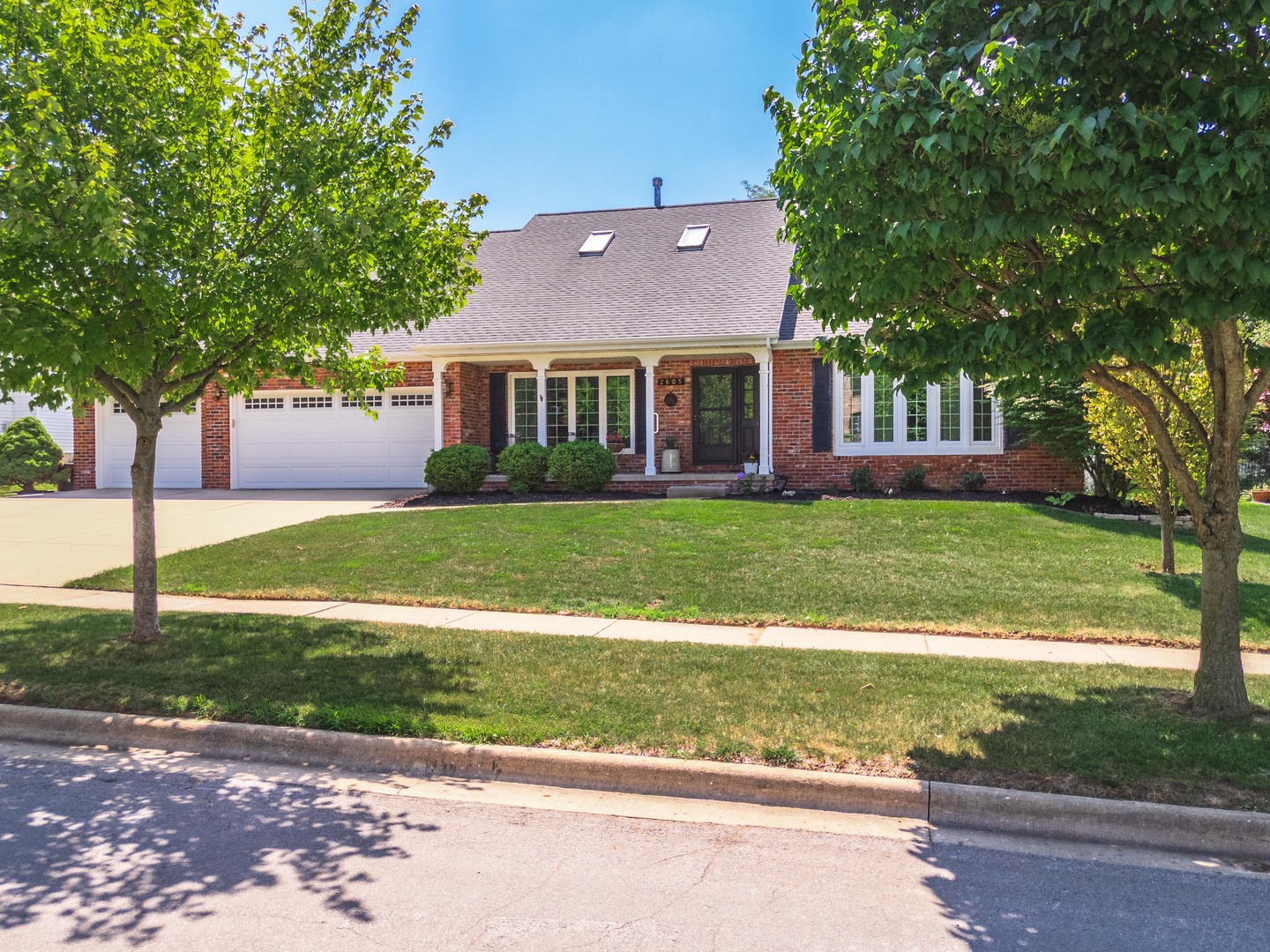 2605 Park Ridge Road Bloomington, IL 61704 - Photo 9 of 69 a view of a house with a big yard and large trees