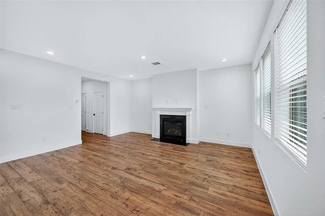 a view of empty room with fireplace