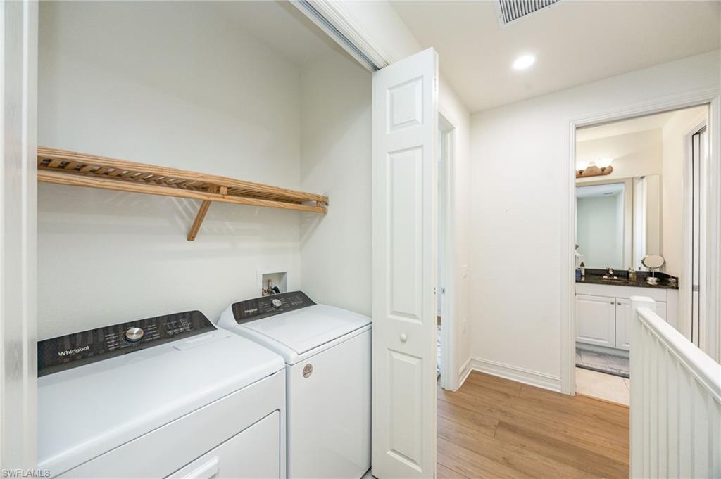 9128 Delano Street, Unit 892 Naples, FL 34113 - Photo 24 of 49 a room with storage and utility