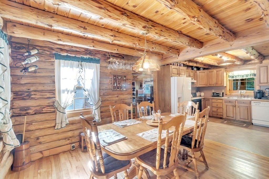 160 Laurel Hill Road Westhampton, MA 01027 - Photo 15 of 42 a dining room with furniture and wooden floor