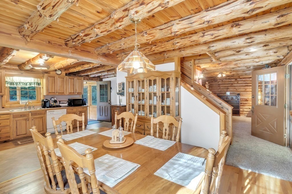 160 Laurel Hill Road Westhampton, MA 01027 - Photo 17 of 42 a view of a dining room with furniture and wooden floor